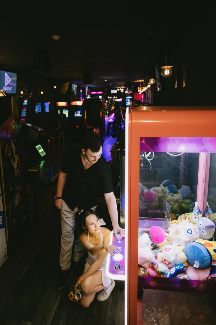 Engagement portrait at the claw machine, Freeplay arcade, Toronto