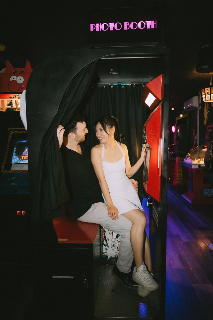 Candid engagement portrait at the photobooth, Freeplay arcade, Toronto
