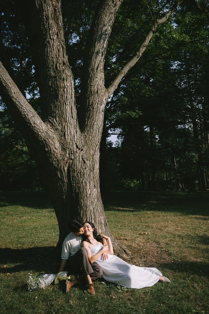 Golden hour engagement portrait by the tree, High Park, Toronto