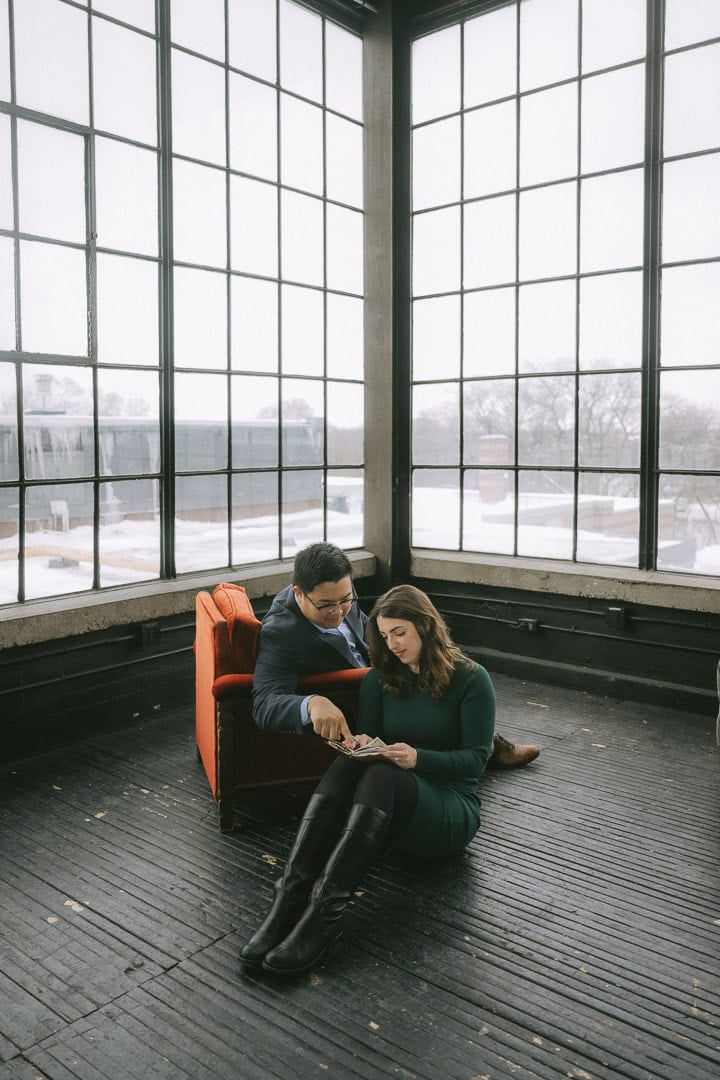 Couple in front of large metal windows, OBJX Studio, Toronto