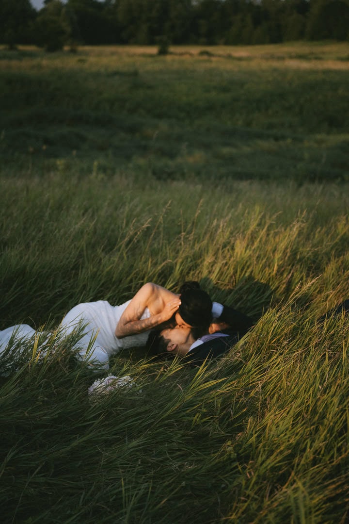 Couple laying in the grass, Scotsdale Farm, Ontario