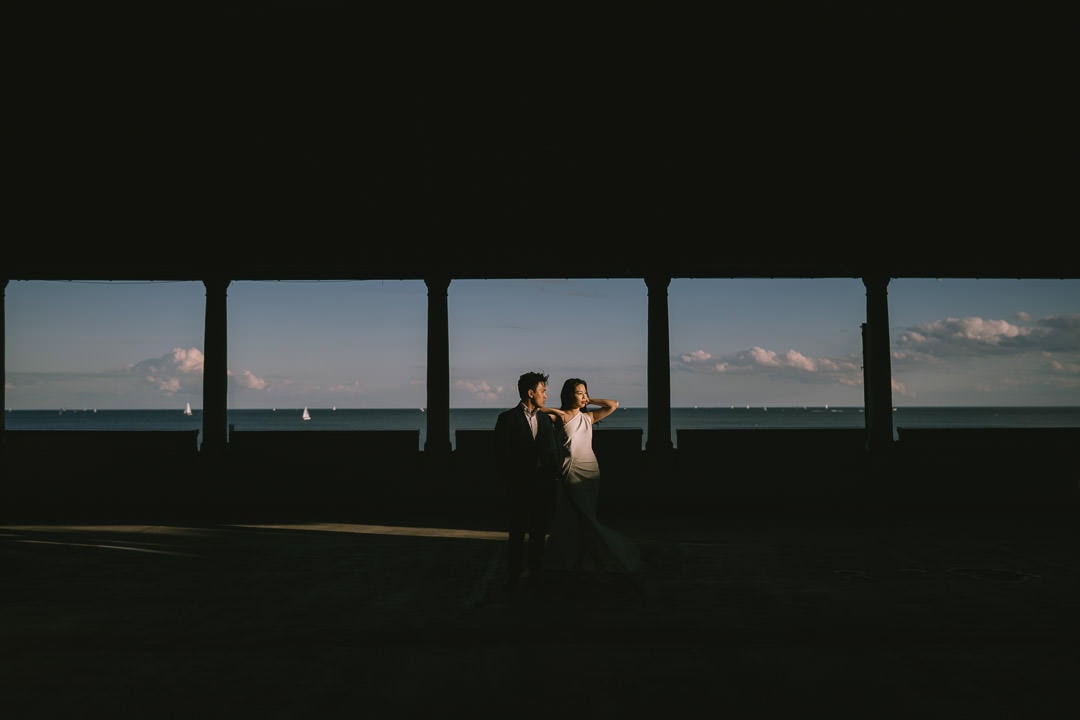 Dramatic light engagement portrait on balcony, Sunnyside Pavilion, Toronto