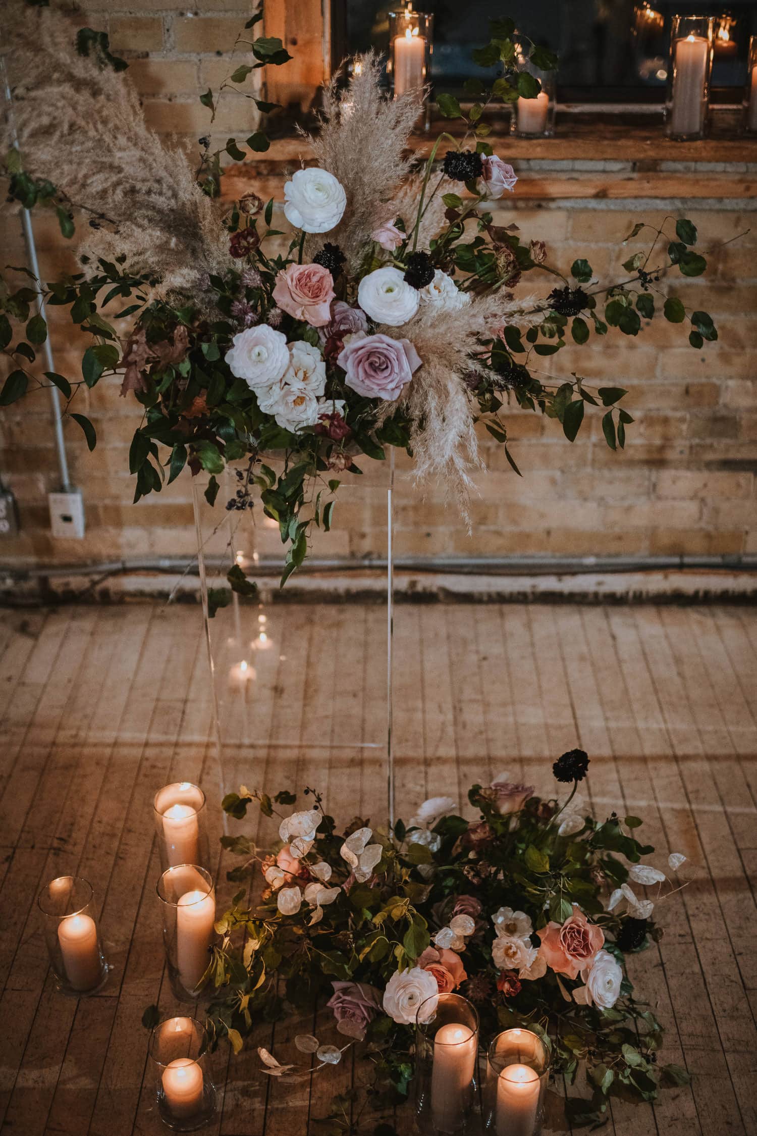 romantic wedding ceremony with string lights, candles, and fall entrepieces