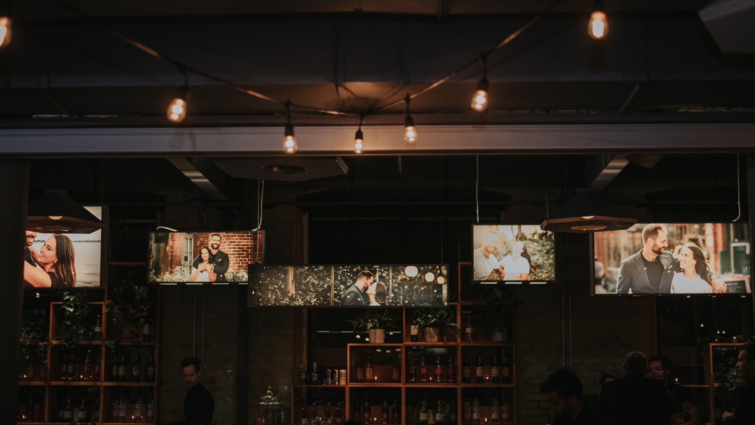 customizable photo lightbox with engagement photos at the wedding reception of Second Floor Events